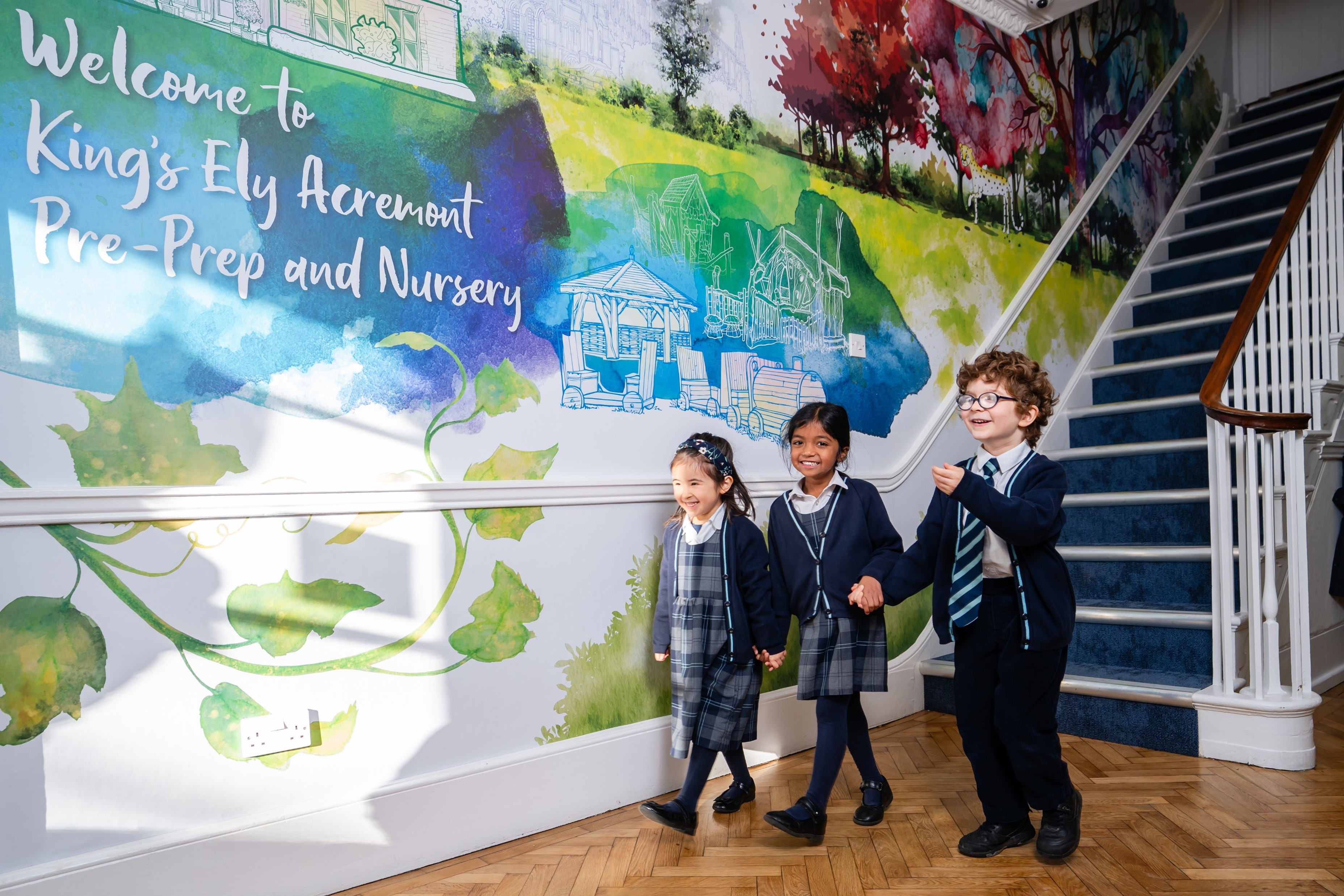 Three children in Reception area of King's Ely Pre-Prep. A private nursery and Pre-Prep in Cambridgeshire