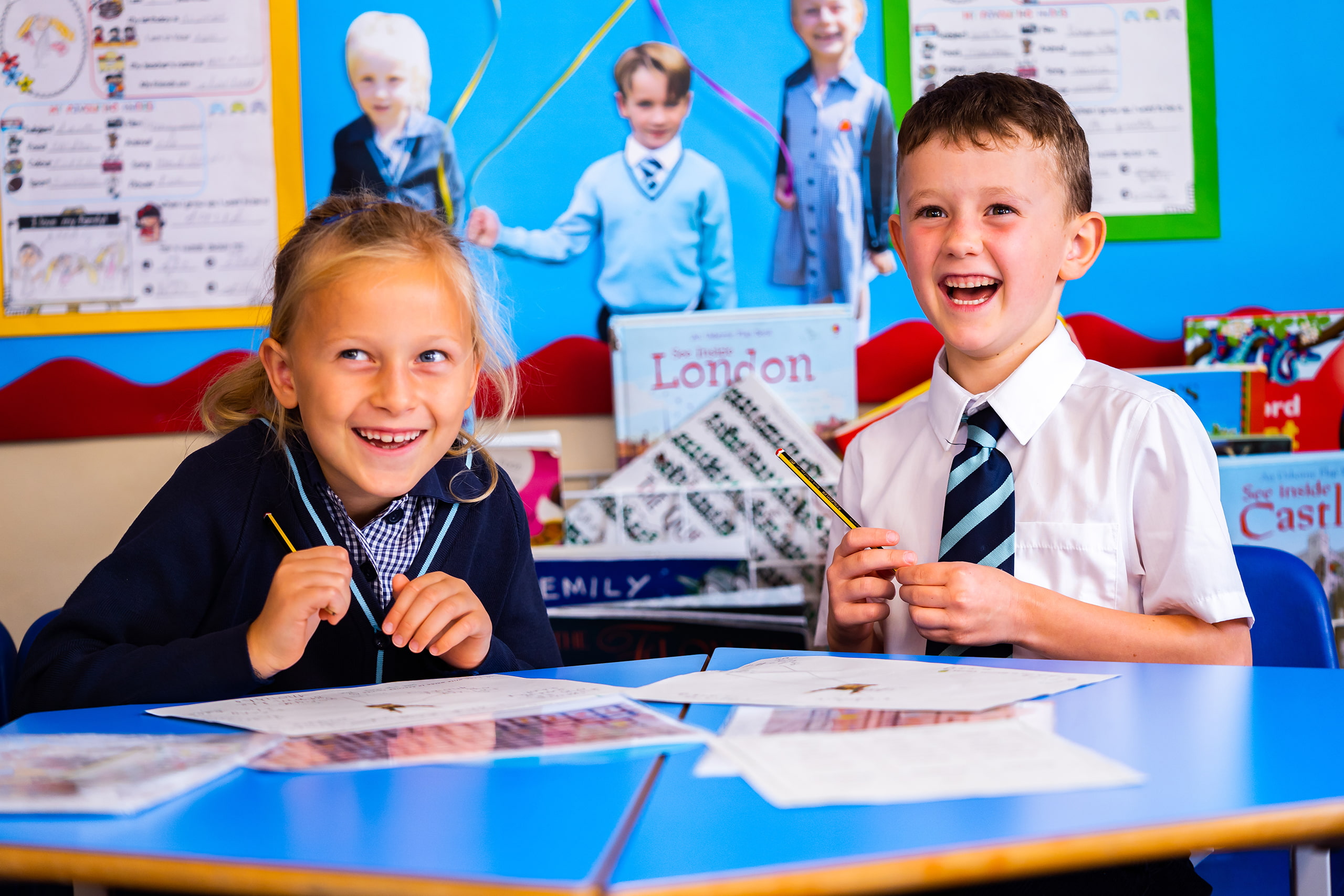 King's Ely Pre-Prep students in the classroom laughing 