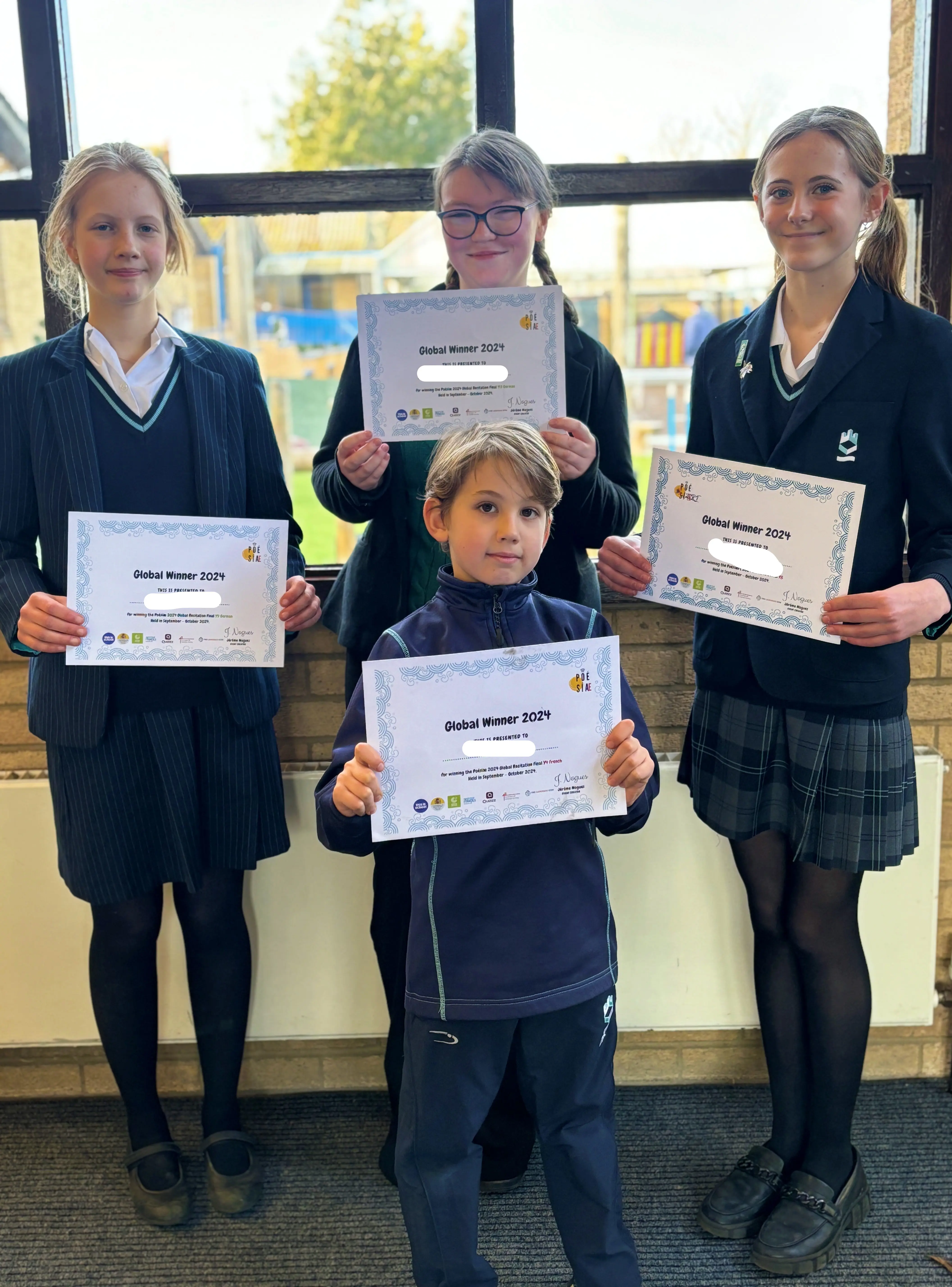 Pupils with their certificates at King's Ely, a private school in Cambridgeshire.