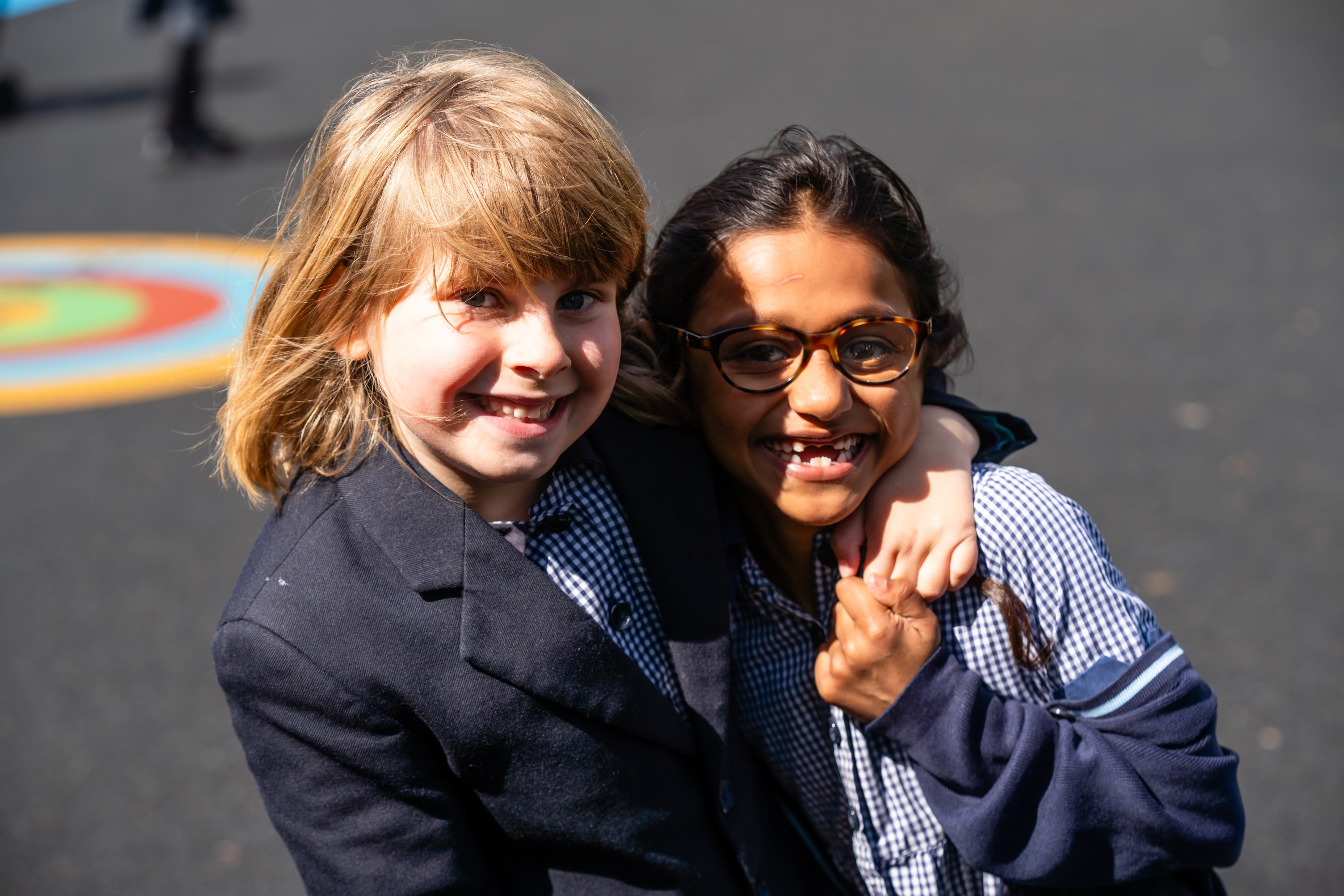 King's Ely Pre-Prep students hugging during playtime 