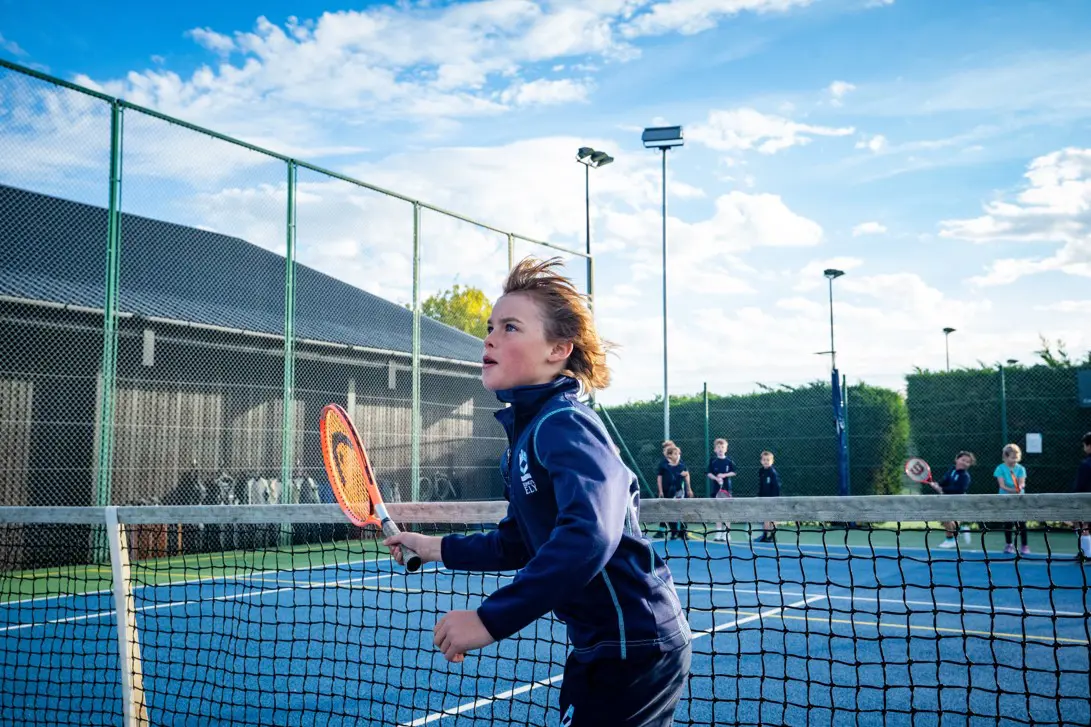 King's Ely Prep student paying tennis