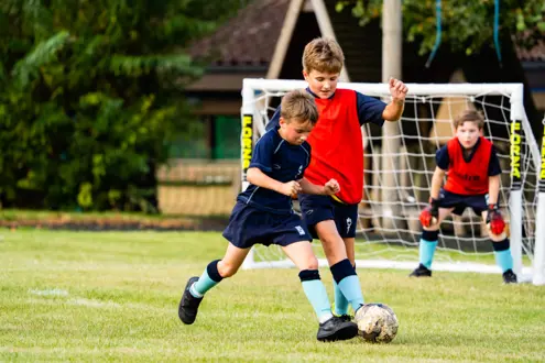 King's Ely Prep students playing football 