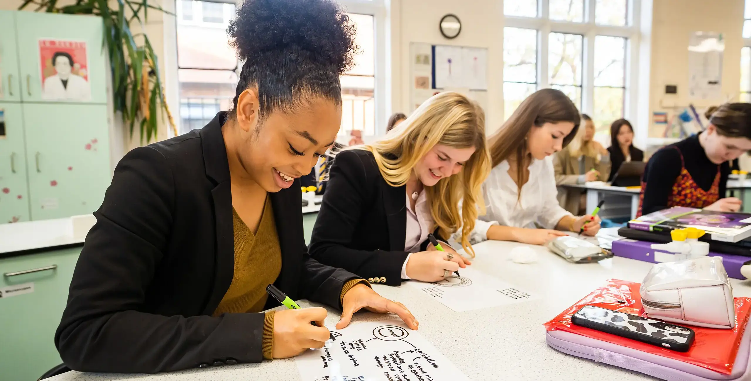 Sixth Form students working in classroom at King’s Ely, a private day and boarding school in Cambridgeshire.