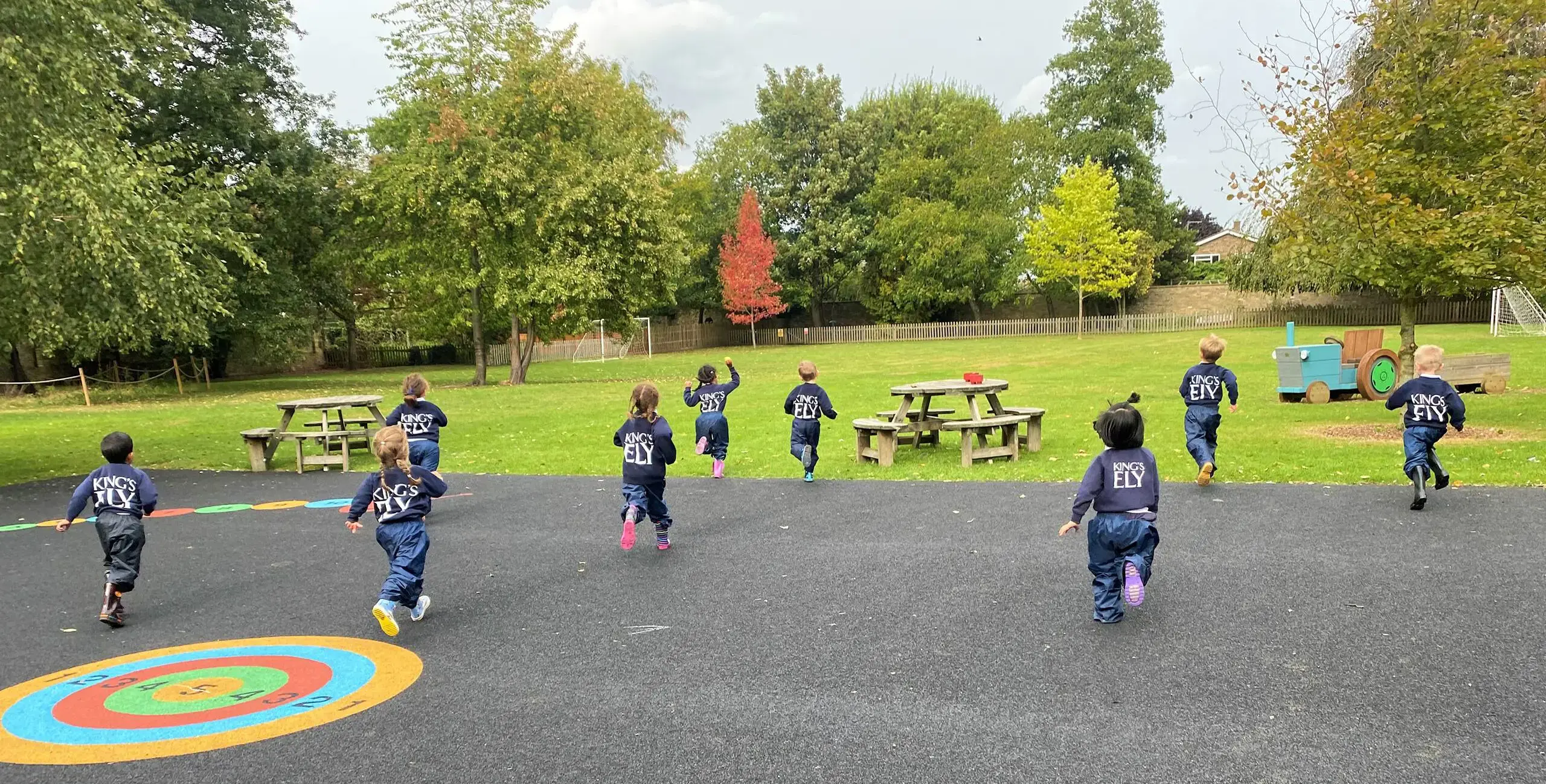 A Group of Children Running Outside at King's Ely, a Private Day and Boarding School near Cambridge, in Ely.